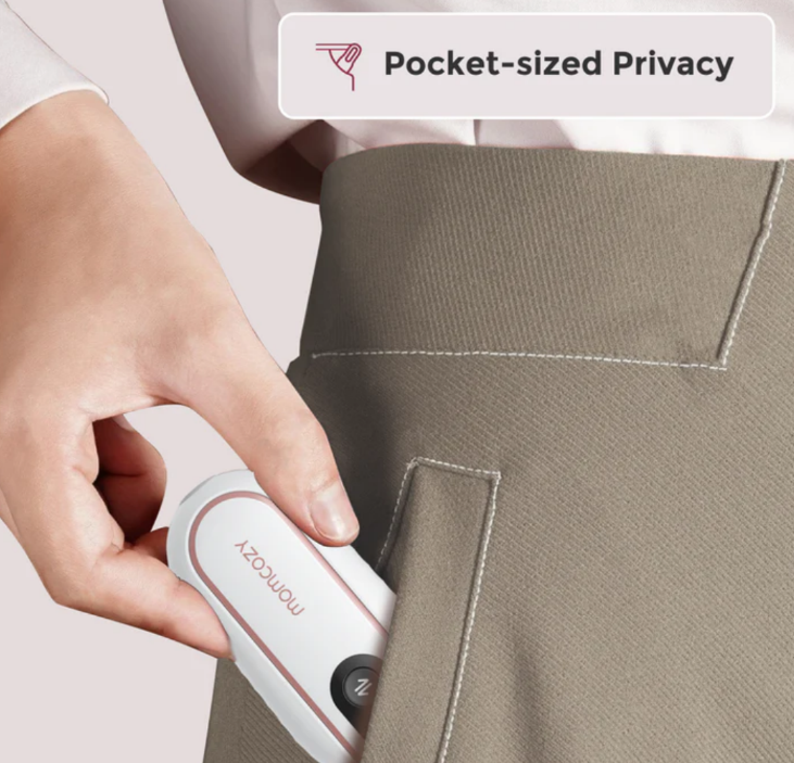 Momcozy V2 portable pump clipped on mom's waistband for easy mobility